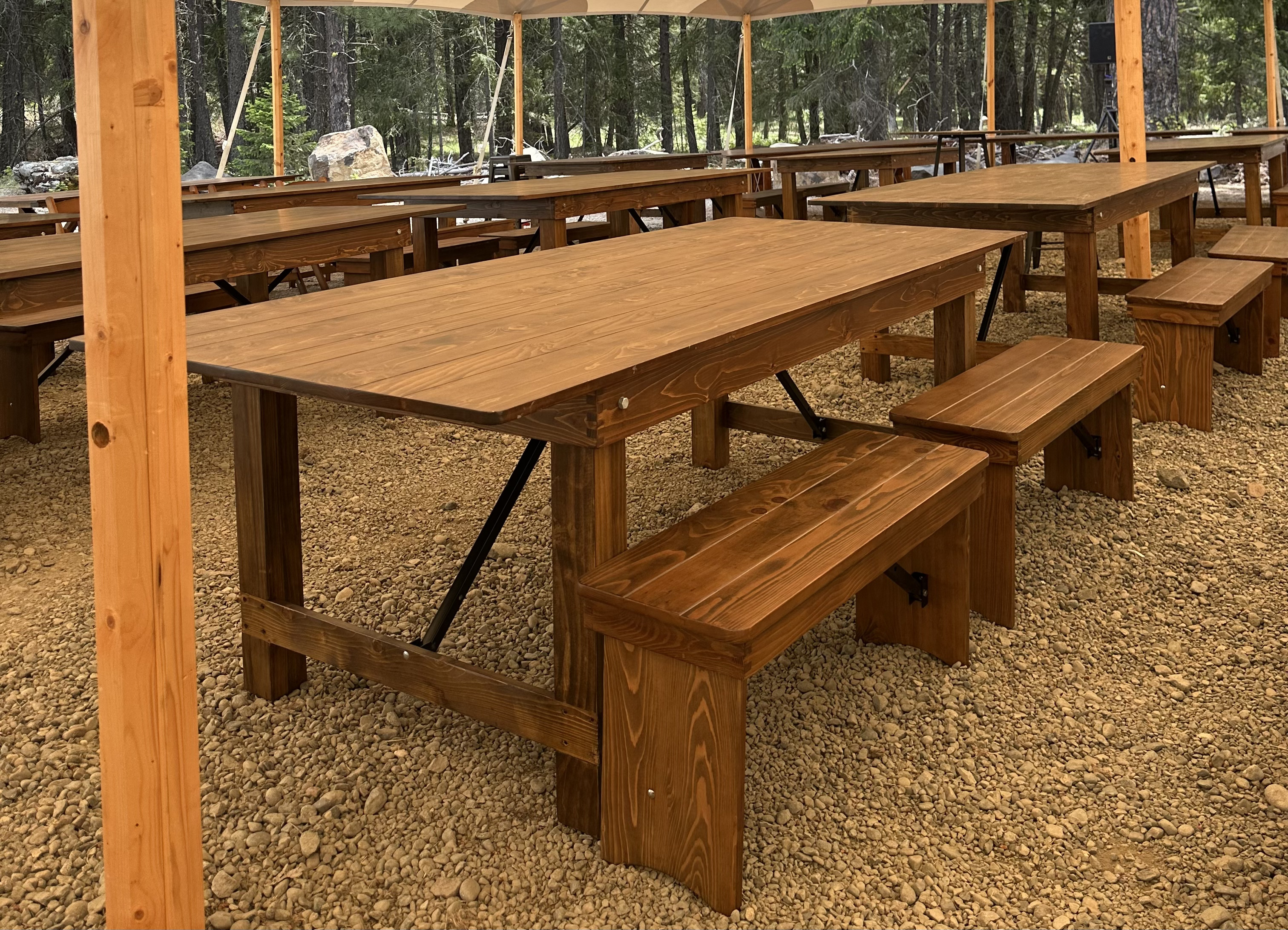 Rustic dining tent rental with farm tables at Suncadia Resort in Cle Elum, Washington