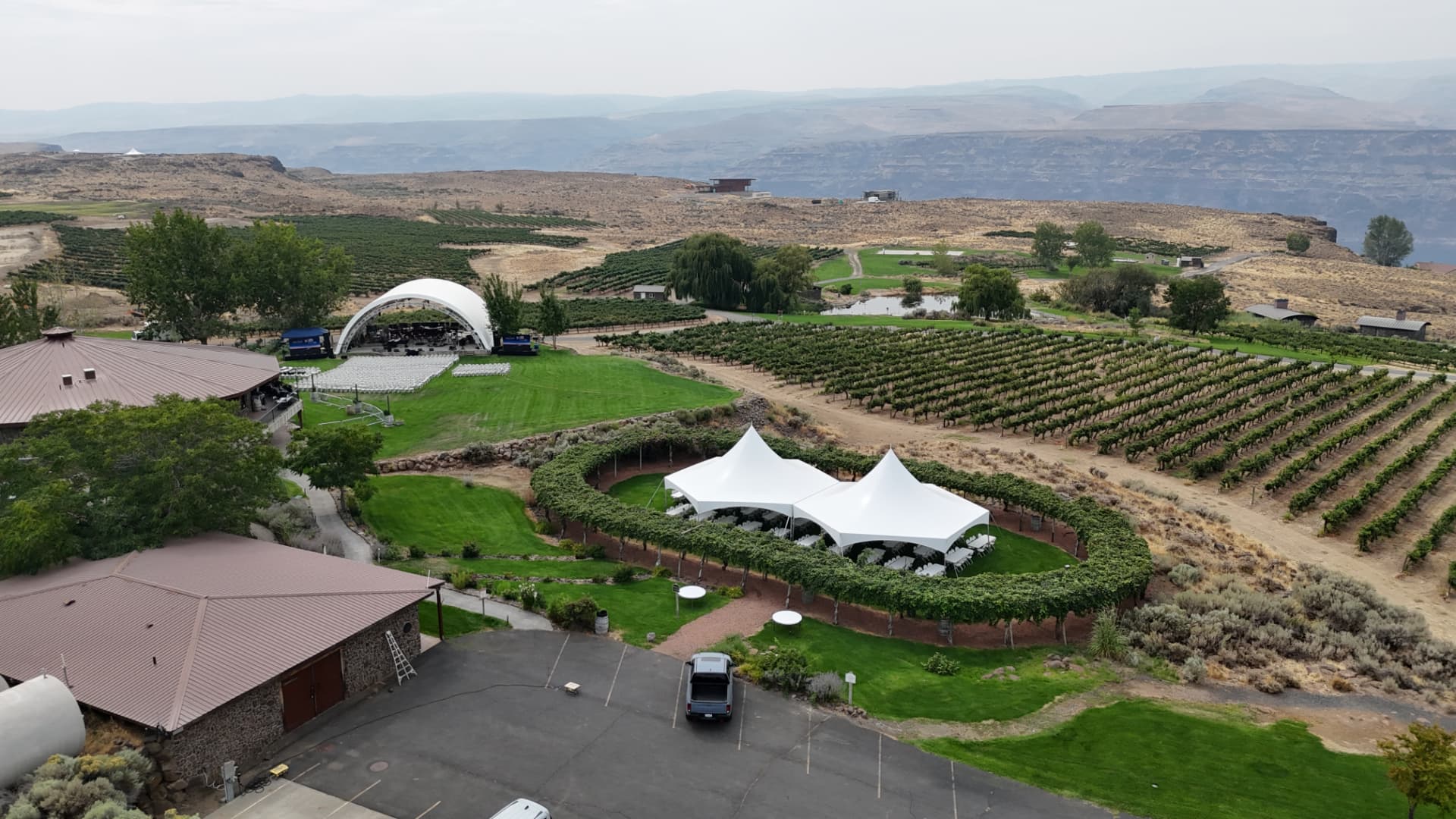 Aerial view of multiple event tent rentals at a vineyard corporate event in Eastern Washington