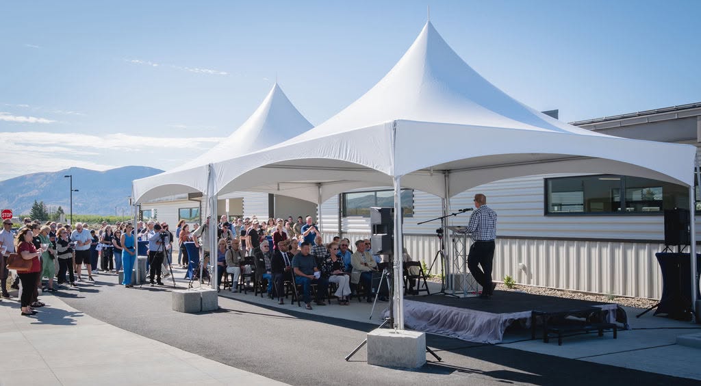 Guests gathered under an event tent rental at a Port district celebration in Eastern Washington