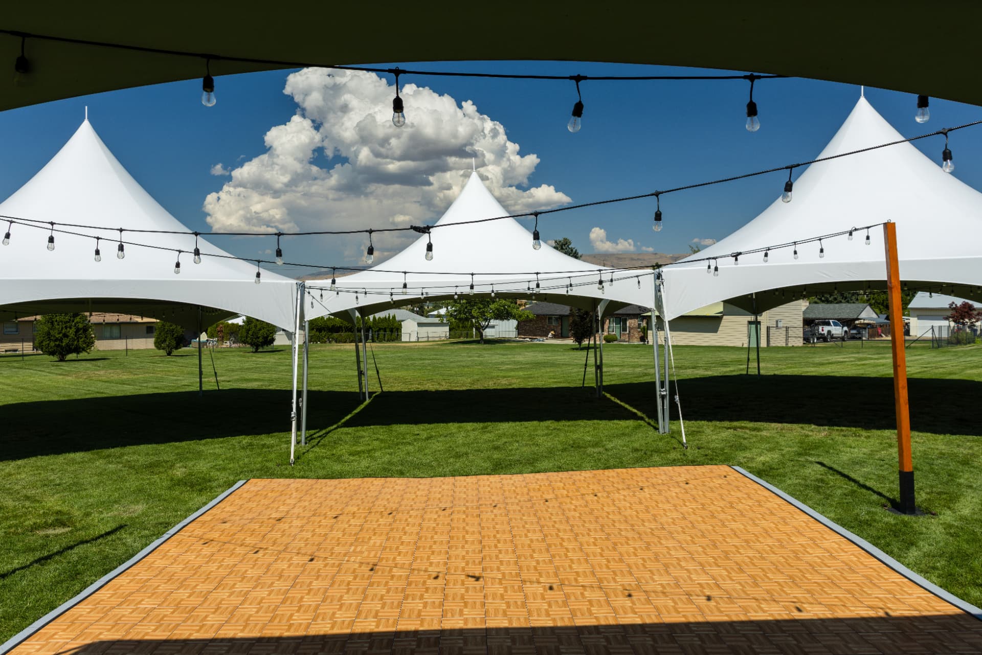Tented wedding reception with table, chair and lighting rentals in Eastern Washington